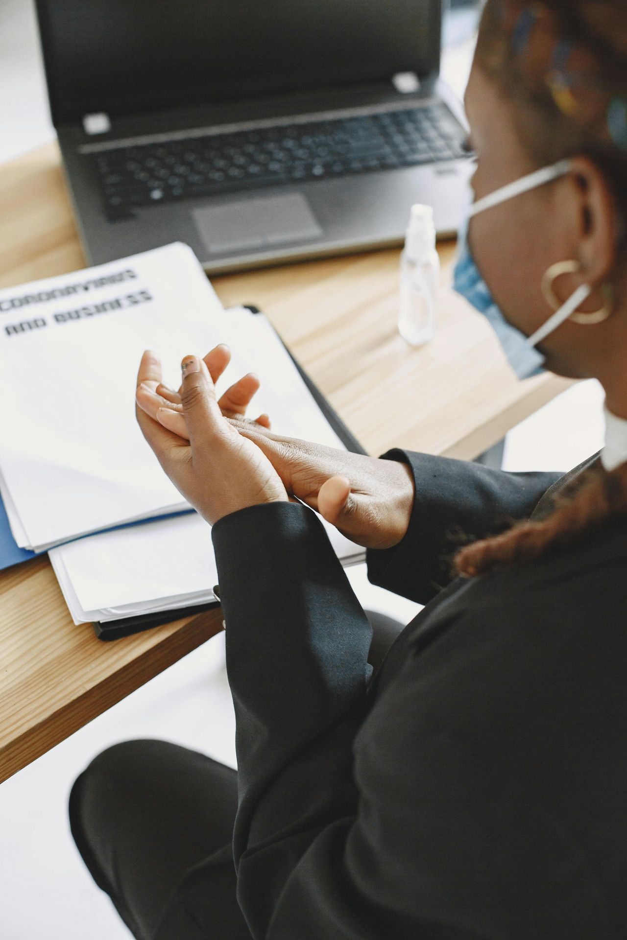 Occupational Safety and Health Training – Workplace Safety and Risk Awareness Employee participating in occupational safety and health training with documents and a laptop on the desk